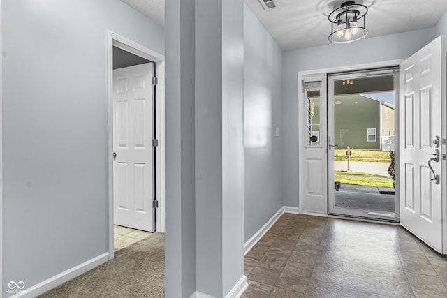 5465 Tanglewood Ln, Whitestown, IN 46075 - entryway with baseboards and stone finish floor