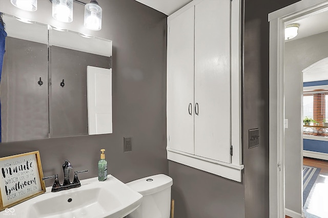 bathroom featuring a sink and toilet
