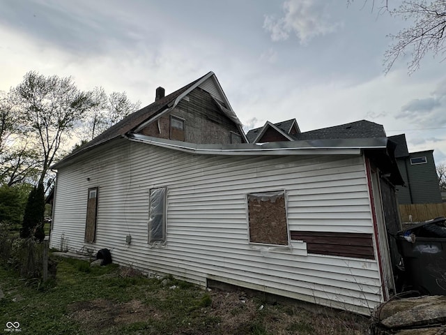 view of home's exterior featuring fence