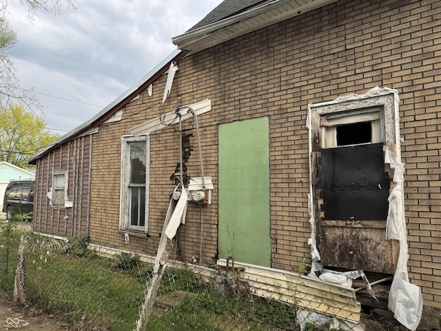 exterior space with brick siding