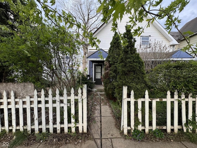 obstructed view of property with a fenced front yard