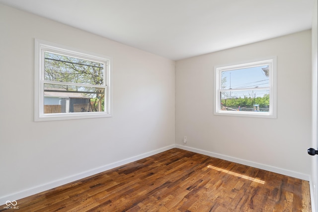2263 N Rural St, Indianapolis, IN 46218 - empty room with baseboards and dark wood finished floors