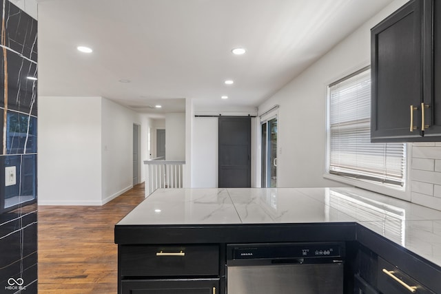 2263 N Rural St, Indianapolis, IN 46218 - kitchen featuring dark cabinets, wood finished floors, a peninsula, recessed lighting, and stainless steel dishwasher