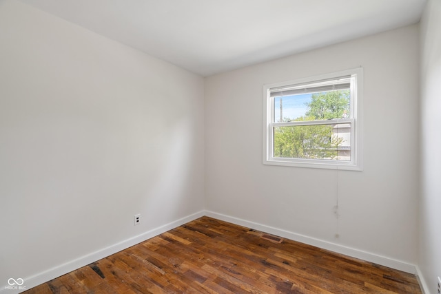 2263 N Rural St, Indianapolis, IN 46218 - empty room with baseboards and dark wood-style floors