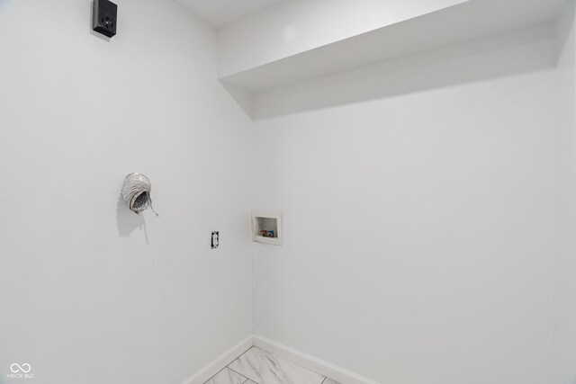 2263 N Rural St, Indianapolis, IN 46218 - washroom featuring baseboards, washer hookup, and light marble finish flooring