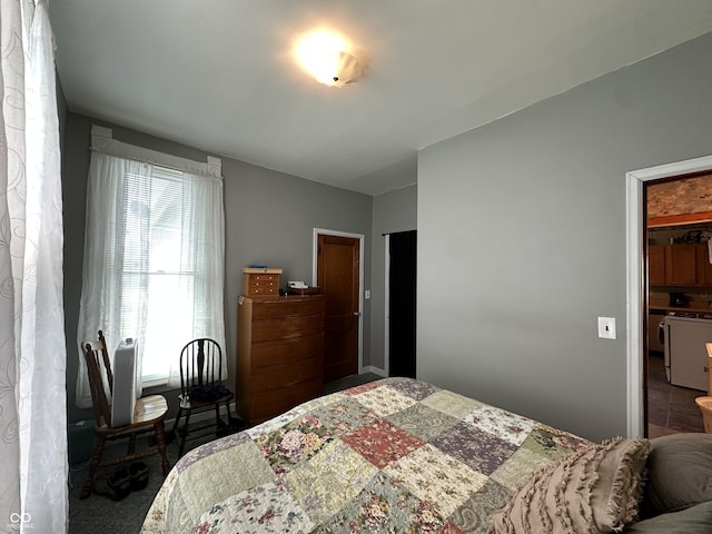 carpeted bedroom with a spacious closet