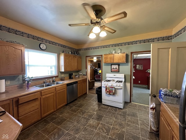 kitchen with white gas stove, a ceiling fan, dishwasher, a sink, and a baseboard heating unit