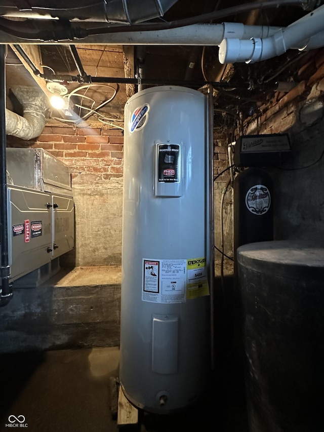 utility room featuring water heater