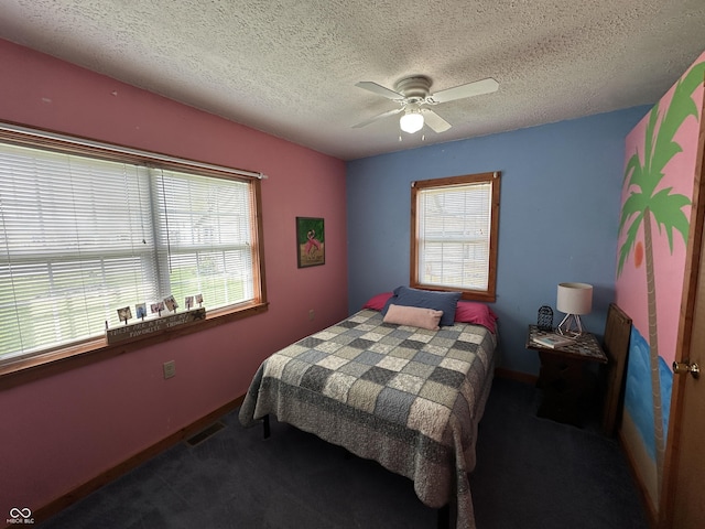 bedroom with baseboards, a textured ceiling, and carpet