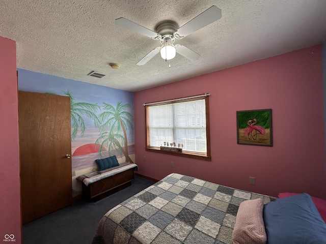 carpeted bedroom with ceiling fan, a textured ceiling, and visible vents