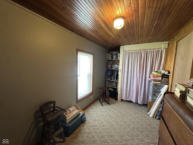 misc room with wood ceiling and carpet