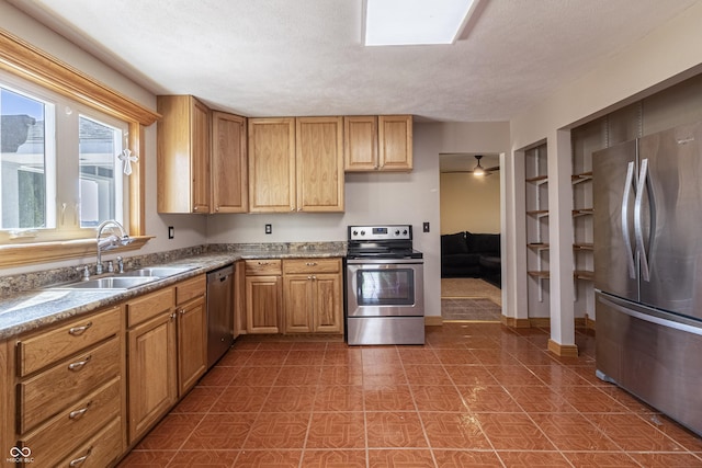 kitchen with a sink and appliances with stainless steel finishes