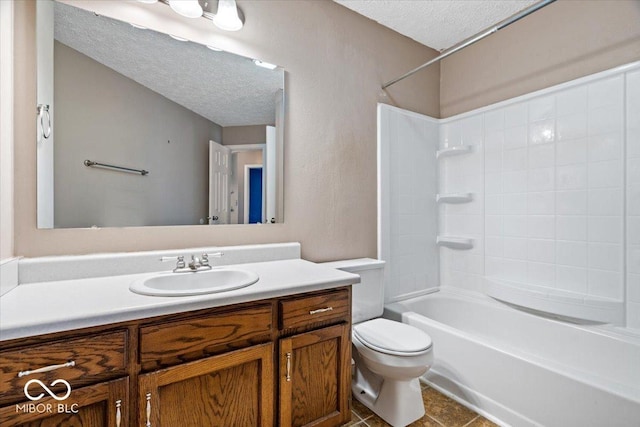 full bathroom featuring tile patterned flooring, vanity, shower / bathtub combination, toilet, and a textured ceiling