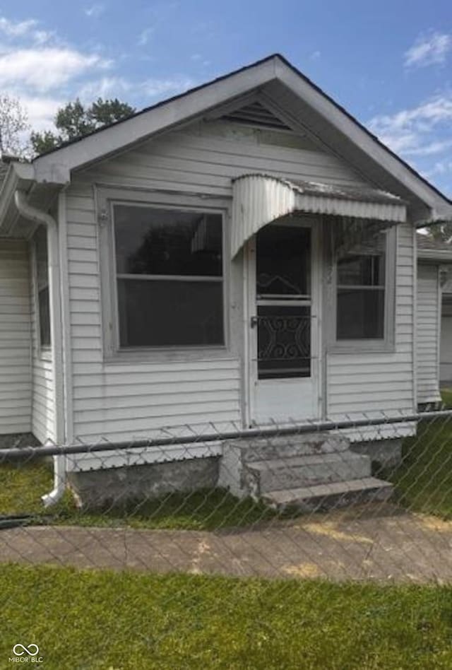 view of front of house with fence