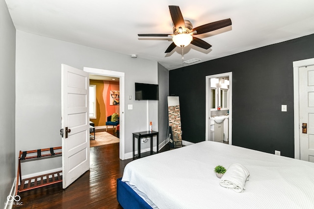 319 S Randolph St, Indianapolis, IN 46201 - bedroom featuring a ceiling fan, visible vents, wood finished floors, baseboards, and ensuite bath