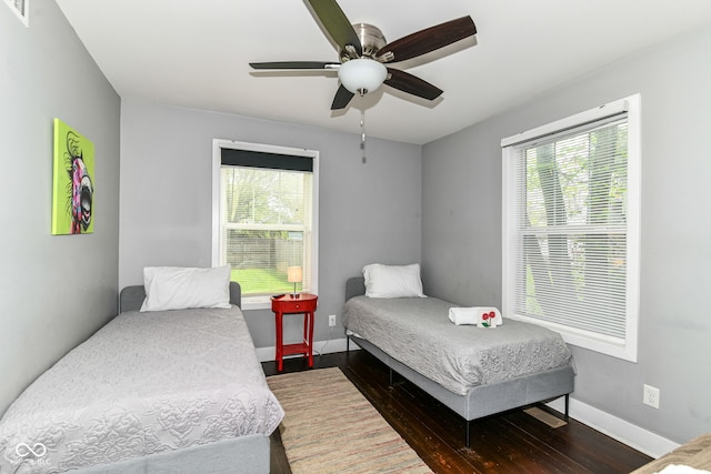 319 S Randolph St, Indianapolis, IN 46201 - bedroom featuring baseboards, multiple windows, and visible vents