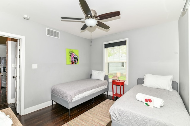 319 S Randolph St, Indianapolis, IN 46201 - bedroom featuring baseboards, a ceiling fan, wood finished floors, and visible vents