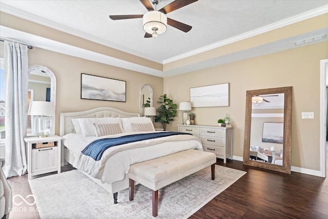 bedroom featuring a ceiling fan, visible vents, crown molding, baseboards, and dark wood-style floors