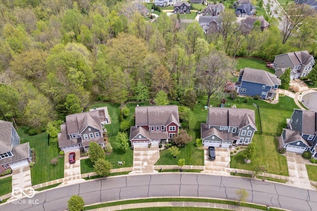 aerial view with a residential view and a view of trees
