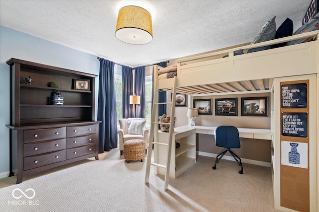 carpeted bedroom featuring baseboards and a textured ceiling