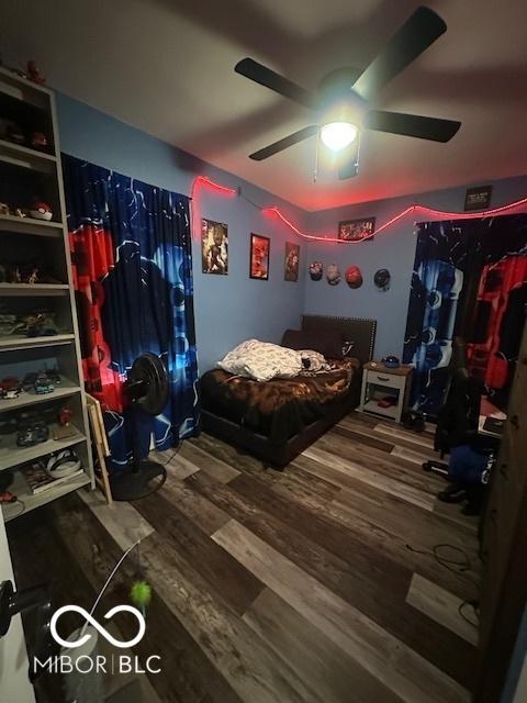 bedroom with ceiling fan and wood finished floors