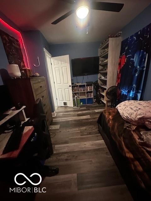 bedroom featuring ceiling fan and wood finished floors