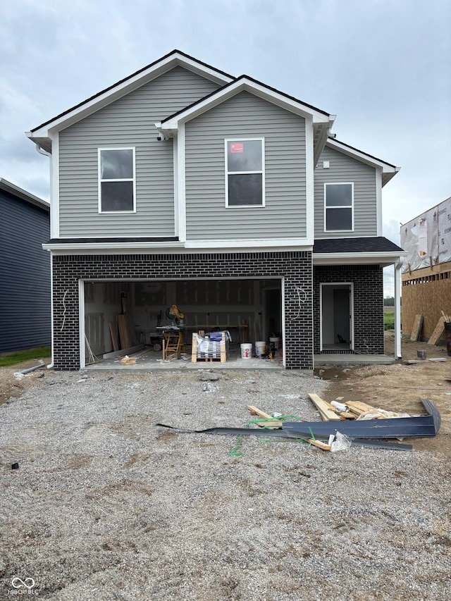 1439 Elm St, Martinsville, IN 46151 - view of front of property with brick siding, driveway, and a garage