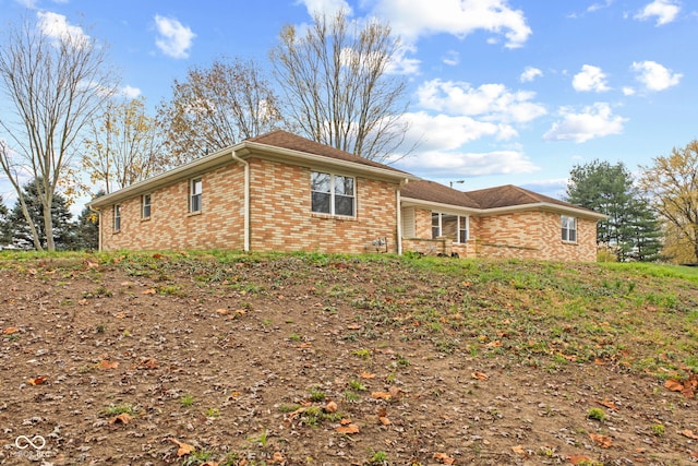 view of front of house featuring brick siding