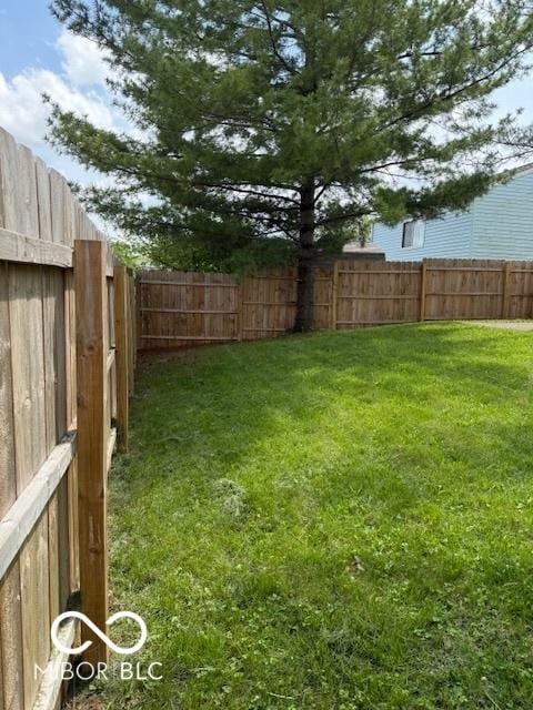 view of yard featuring a fenced backyard