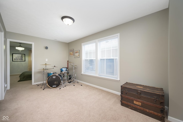 game room featuring carpet floors and baseboards