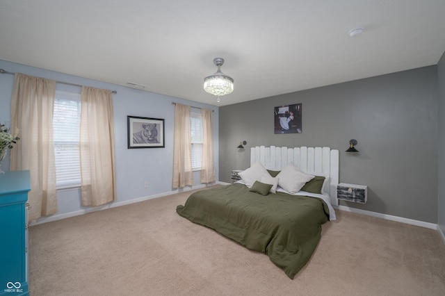 bedroom featuring carpet floors, baseboards, and visible vents