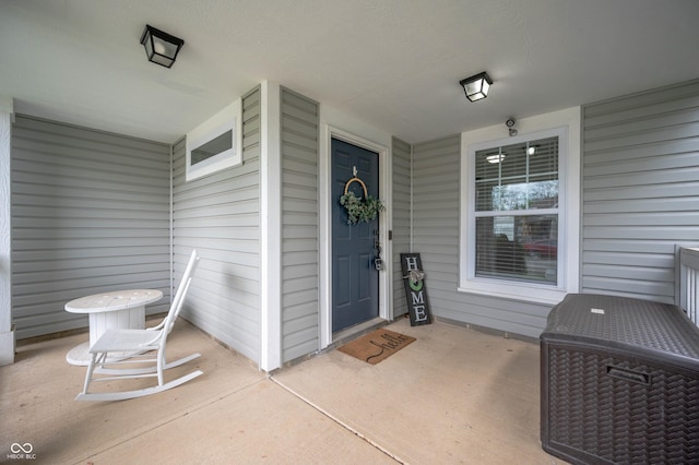 property entrance with covered porch