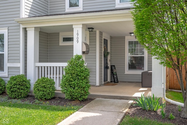 doorway to property featuring covered porch