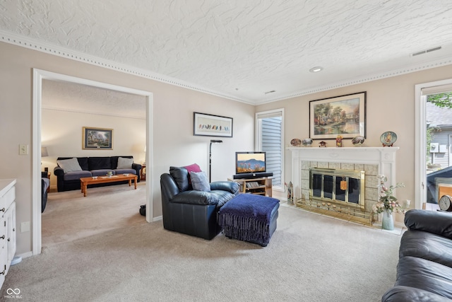 1030 Stratford Hall Unit 17-3, Indianapolis, IN 46260 - carpeted living area with a textured ceiling, crown molding, a fireplace with flush hearth, and baseboards