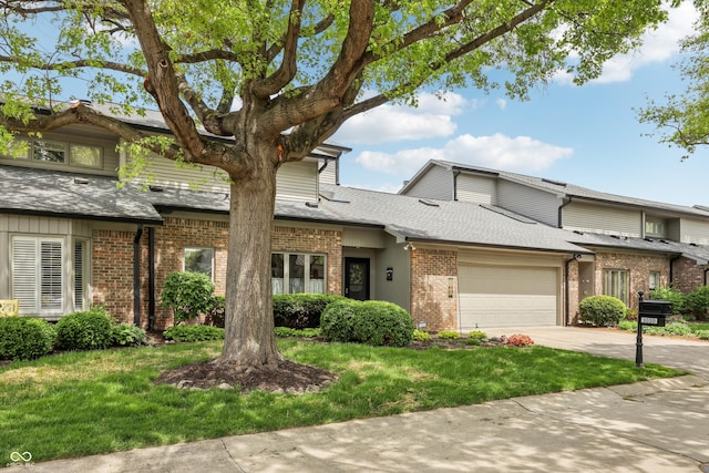 1030 Stratford Hall Unit 17-3, Indianapolis, IN 46260 - multi unit property featuring brick siding, an attached garage, driveway, roof with shingles, and a front lawn