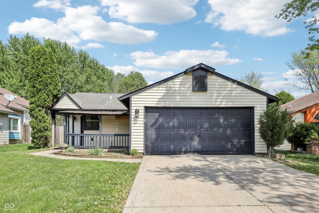 5323 Shefford Ct, Indianapolis, IN 46254 - ranch-style home featuring a porch, a garage, driveway, and a front lawn