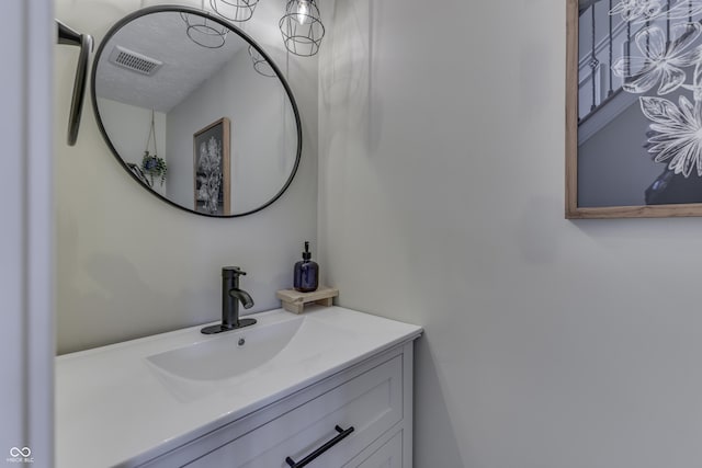 bathroom featuring visible vents and vanity