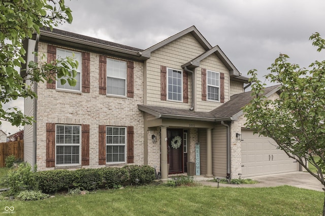 view of front facade featuring a front yard and brick siding