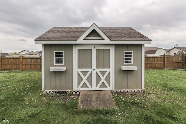 view of shed featuring a fenced backyard