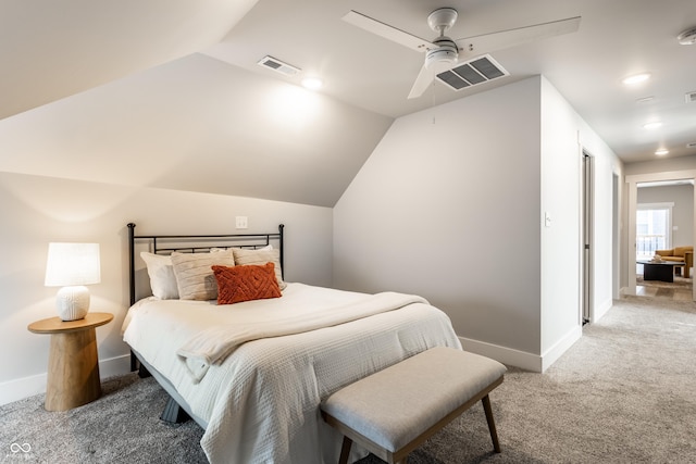 carpeted bedroom featuring baseboards, visible vents, ceiling fan, and vaulted ceiling
