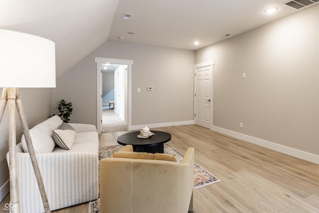 living room featuring light wood finished floors, recessed lighting, baseboards, vaulted ceiling, and visible vents