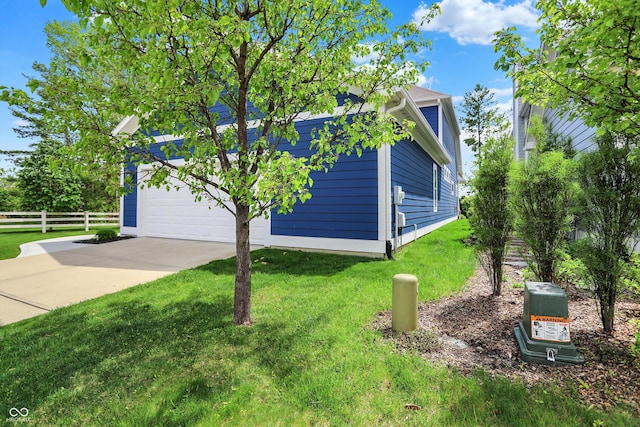 view of property exterior with concrete driveway