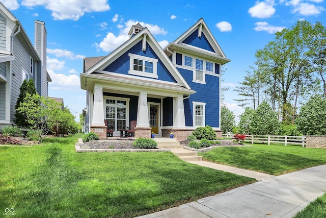craftsman-style home with a porch and brick siding