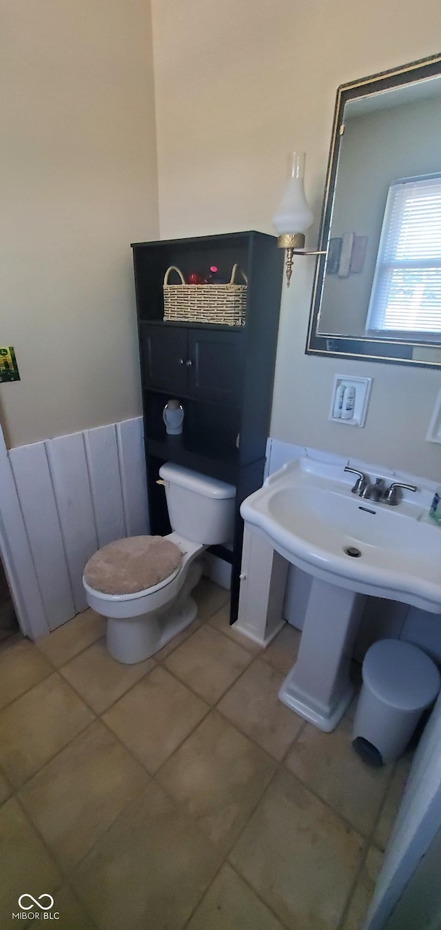 bathroom featuring tile patterned floors and toilet