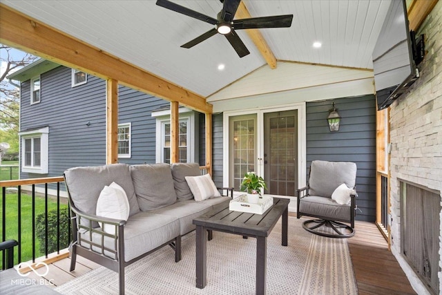 deck with an outdoor living space and ceiling fan