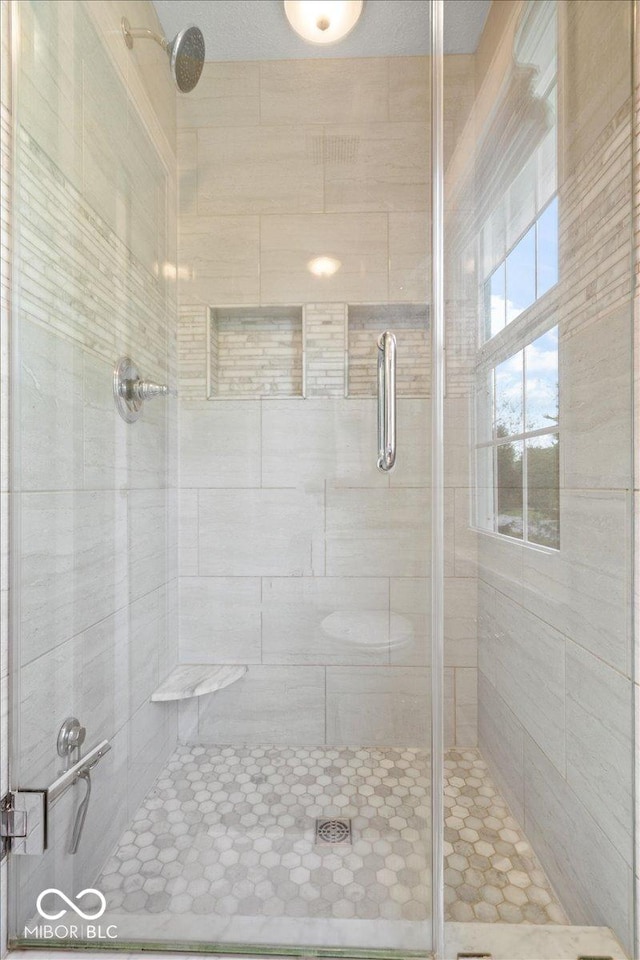 full bathroom featuring a stall shower