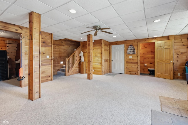 4840 N Templin Rd, Martinsville, IN 46151 - unfurnished living room with stairs, ceiling fan, wooden walls, recessed lighting, and carpet
