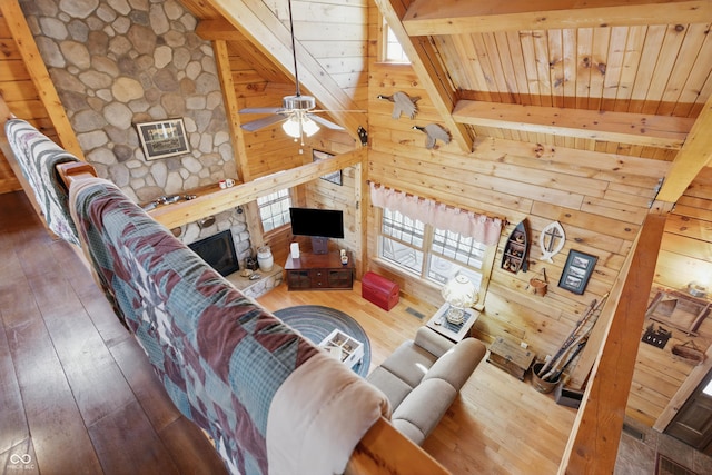 4840 N Templin Rd, Martinsville, IN 46151 - living room featuring ceiling fan, wood walls, a stone fireplace, hardwood / wood-style floors, and wooden ceiling