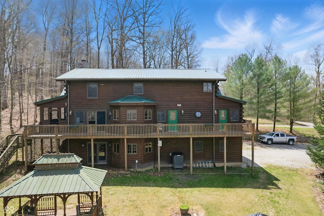 4840 N Templin Rd, Martinsville, IN 46151 - back of property featuring central AC unit, a wooden deck, a yard, and metal roof