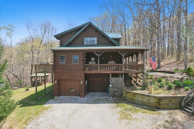 4840 N Templin Rd, Martinsville, IN 46151 - log-style house with a garage, gravel driveway, metal roof, stairs, and log siding